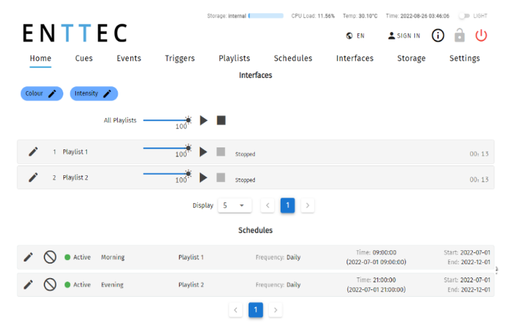 S-PLAY LITE Home page — top menu, All Playlists master control, per-playlist rows with intensity, play/stop and status, and an overview of Interfaces and Schedules for end-user playback control
