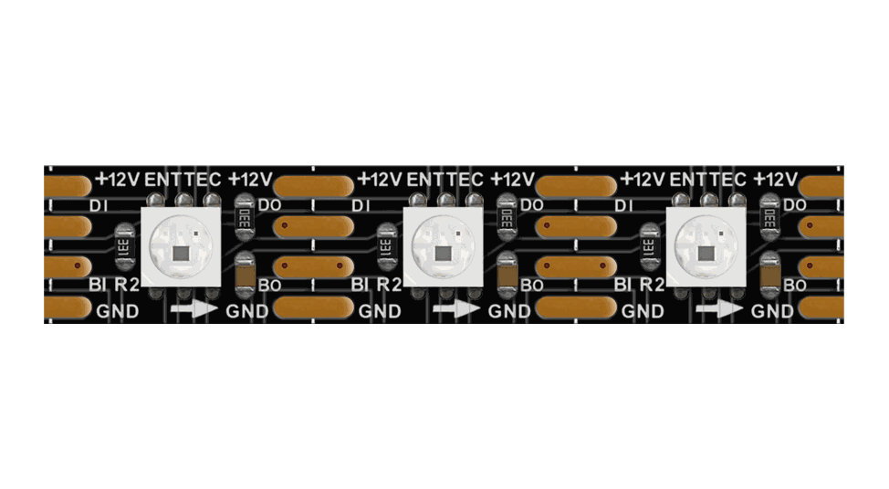 Close-up of the black PCB strip, three LEDs between copper solder pads marked ENTTEC, DI, DO, BI, BO and GND.