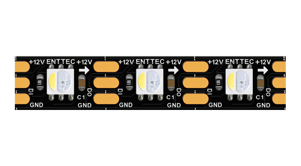 Close-up of the black PCB strip, a white emitter beside a three-in-one RGB emitter, between copper solder pads marked ENTTEC, +12V, DI, DO and GND.