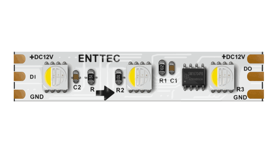 The same strip on a white PCB, three LED packages of four emitters each between copper solder pads marked +DC12V, DI, DO and GND.