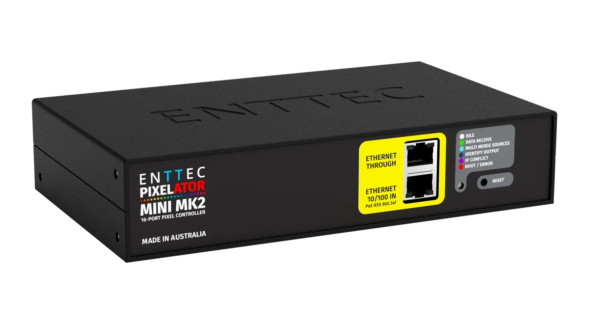 The Pixelator Mini MK2 turned to the left, showing the stacked Ethernet Through and Ethernet 10/100 IN sockets on their yellow panel, the six-colour LED key and the Reset button.