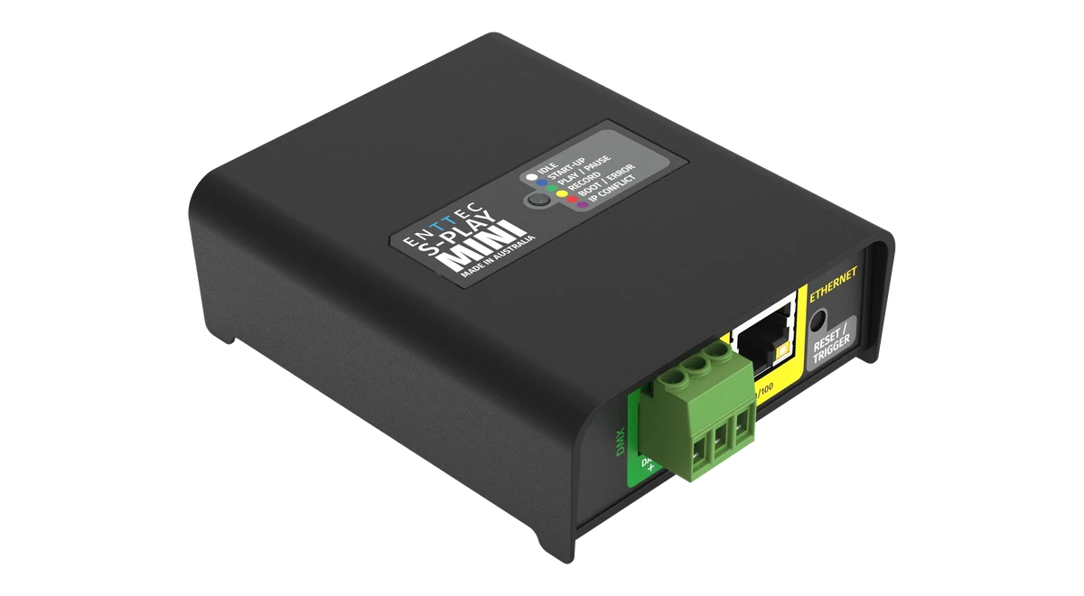 The S-PLAY MINI seen from directly above, its black lid carrying a label printed ENTTEC S-PLAY MINI beside a recessed button and a colour key listing IDLE, START-UP, PLAY / PAUSE, RECORD, BOOT / ERROR and IP CONFLICT, with green screw terminals along the top and bottom edges.