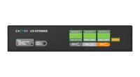 The black I/O Extender seen from above and in front, ENTTEC embossed across the lid, the front panel carrying the ENTTEC I/O EXTENDER name, an LED legend, a RESET / IDENTIFY button and green terminal labels, with green screw terminals rising from the far edge.