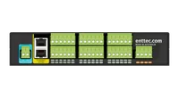 The rear face of the black I/O Extender: a blue POWER block marked V- and V+, a yellow Ethernet 10/100 panel with two RJ45 sockets, three banks of green screw terminals labelled GND, IN1 to IN20 and relay NC/CM/NO, and an orange AIN1/AIN2 block beside enttec.com Made in Australia.