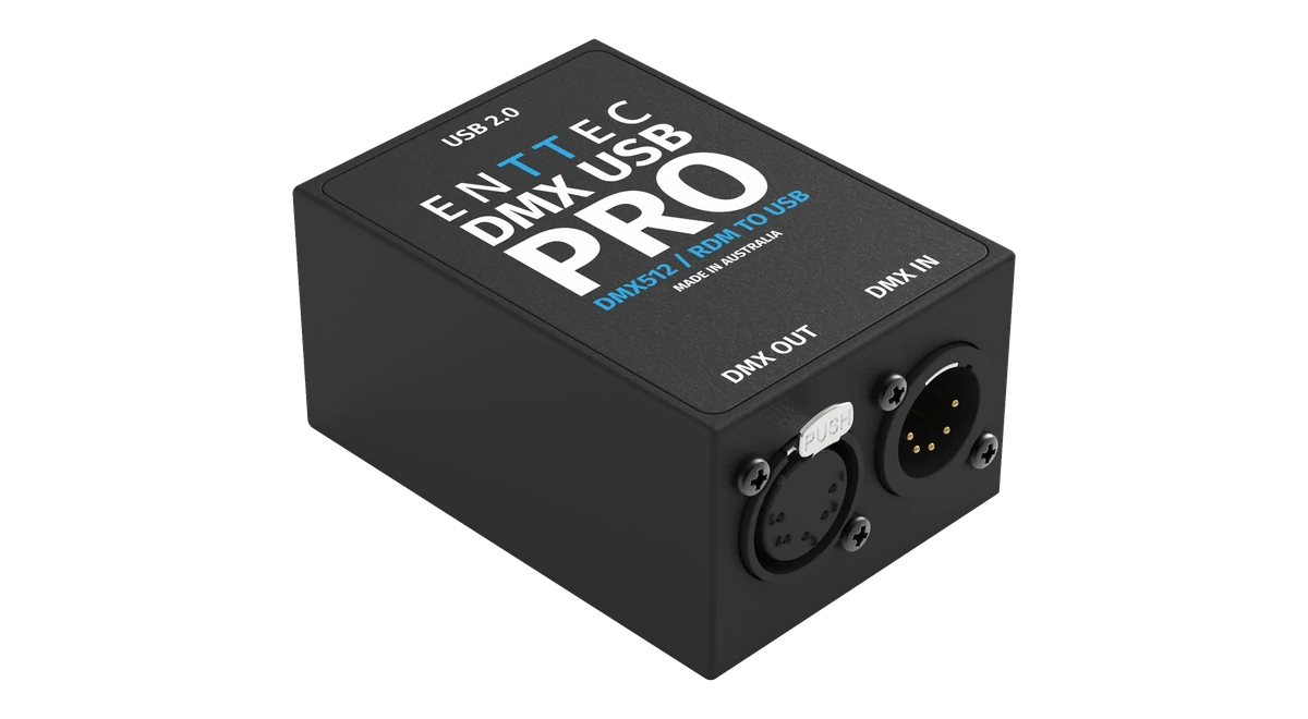 The DMX USB Pro at a three-quarter angle, its lid printed USB 2.0, ENTTEC DMX USB PRO, DMX512 / RDM TO USB and MADE IN AUSTRALIA, with a female DMX OUT XLR under a silver PUSH latch and a male DMX IN XLR on the end panel.