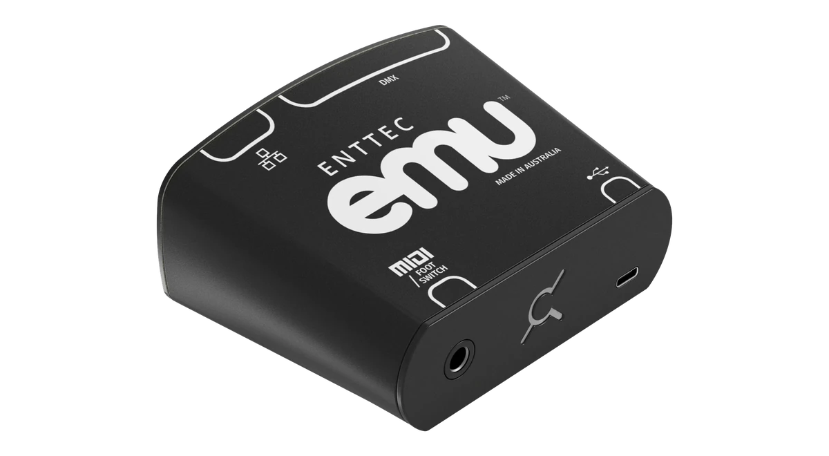 The EMU hardware interface at a three-quarter angle, its lid printed ENTTEC emu and MADE IN AUSTRALIA with Ethernet, DMX, MIDI / FOOT SWITCH and USB port markings, and a jack socket, the EMU logo and a USB-C port along the near face.