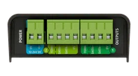 Plain long side of the enclosure, a flat black slab with one green terminal block showing at the far end.
