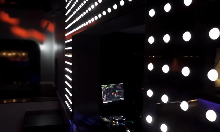 A screen running the mapping software beside a vertical strip of pixel dots, more dots blurred in the foreground