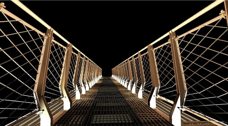 One point perspective straight down the walkway, mesh balustrades on both sides picked out in white light against black