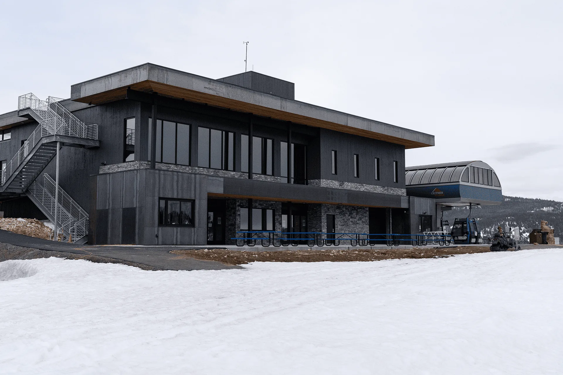 The Aurora summit building at Snow King Mountain, seen from the snow on a clear day