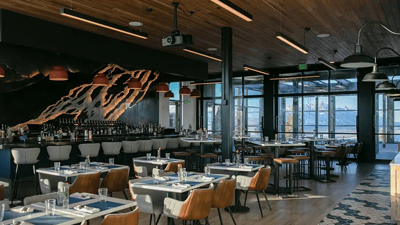 The Aurora restaurant dining room, the SnowGlow sculpture running the length of the bar wall