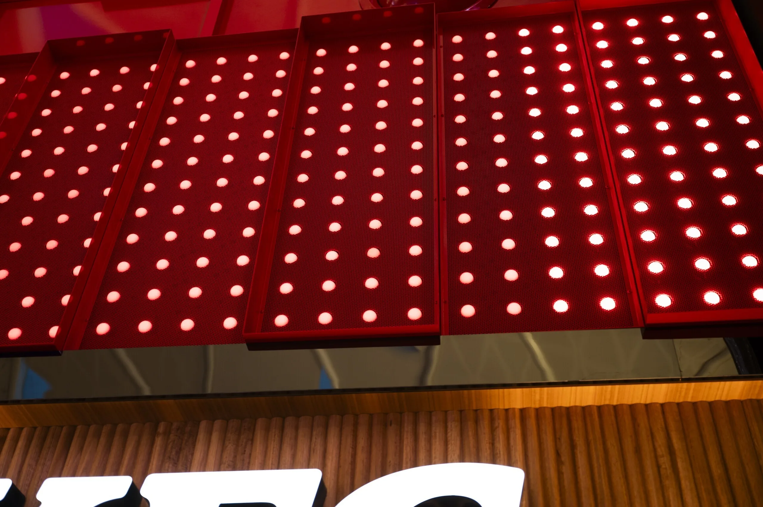 Looking up at the angled dot panels on the underside of the box, the top of the white KFC lettering below them