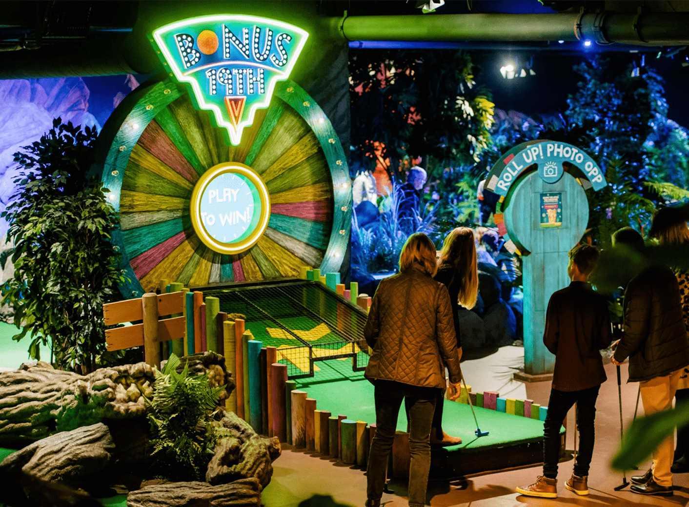 Treetop Adventure Golf indoor mini-golf with rainforest-themed neon lighting powered by ENTTEC OCTO