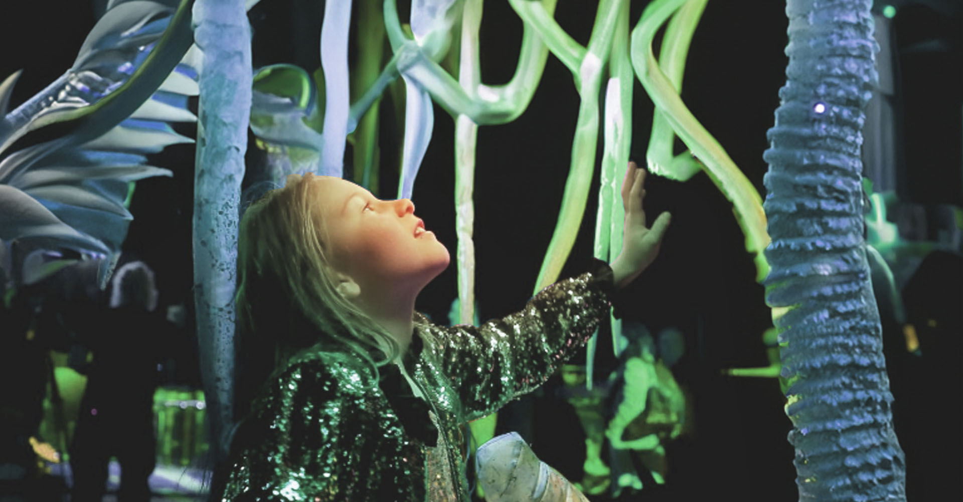 Young girl in awe of spectacular light show